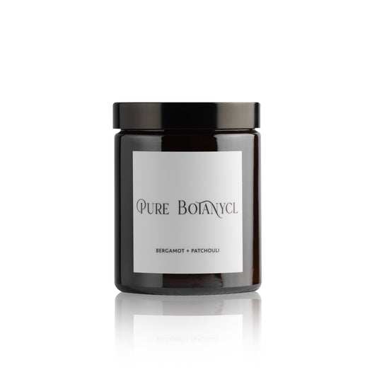 Pure Botanycl Candle in Bergamot and Patchouli. The captivating aroma within this beautiful scented candle will entice you into a dreamy land of love. A citrus twist of Bergamot and Orange, will fill the air with a zest and softness all rolled into one. Furthermore, the decadent note of Jasmine all resting on a rich, earthy base of Patchouli will leave you engulfed in a beautifully scented candle that you will keep coming back to day after day.